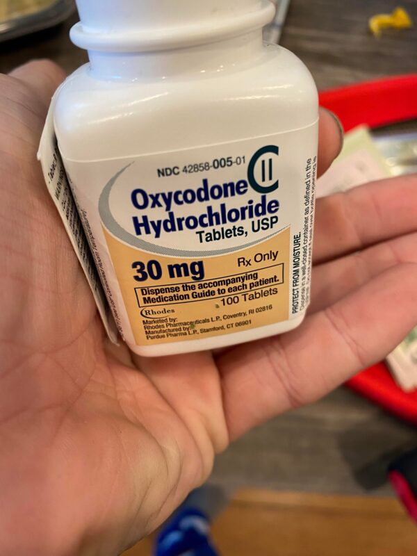 Oxycodone Hydrochloride Oxycodone, sold under various brand names such as Roxicodone and OxyContin (which is the extended release form), is a semi-synthetic opioid used medically for treatment of moderate to severe pain. It is highly addictive and It is usually taken by mouth, and is available in immediate-release and controlled-release formulations. Onset of pain relief typically begins within fifteen minutes and lasts for up to six hours with the immediate-release formulation. In the United Kingdom, it is available by injection. Combination products are also available with paracetamol (acetaminophen), ibuprofen, naloxone, naltrexone, and aspirin. Medical uses Oxycodone is used for managing moderate to severe acute or chronic pain when other treatments are not sufficient. It may improve quality of life in certain types of pain. Numerous studies have been completed, and the appropriate use of this compound does improve the quality of life of patients with long term chronic pain syndromes. Oxycodone is available as a controlled-release tablet, intended to be taken every 12 hours. A 2006 review found that controlled-release oxycodone is comparable to immediate-release oxycodone, morphine, and hydromorphone in management of moderate to severe cancer pain, with fewer side effects than morphine. The author concluded that the controlled-release form is a valid alternative to morphine and a first-line treatment for cancer pain. In 2014, the European Association for Palliative Care recommended oxycodone by mouth as a second-line alternative to morphine by mouth for cancer pain. Available forms See also: Oxycodone/paracetamol, Oxycodone/aspirin, Oxycodone/ibuprofen, and Oxycodone/naloxone Both sides of a single 10mg OxyContin pill. Oxycodone is available in a variety of formulations for by mouth or under the tongue: Immediate-release oxycodone (OxyFast, OxyIR, OxyNorm, Roxicodone) Controlled-release oxycodone (OxyContin, Xtampza ER) – 10–12 hour duration Oxycodone tamper-resistant (OxyContin OTR) Immediate-release oxycodone with paracetamol (acetaminophen) (Percocet, Endocet, Roxicet, Tylox) Immediate-release oxycodone with aspirin (Endodan, Oxycodan, Percodan, Roxiprin) Immediate-release oxycodone with ibuprofen (Combunox) Controlled-release oxycodone with naloxone (Targin, Targiniq, Targinact)[38] – 10–12 hour duration Controlled-release oxycodone with naltrexone (Troxyca) – 10–12 hour duration A liquid solution containing 10mg of oxycodone per 1ml In the US, oxycodone is only approved for use by mouth, available as tablets and oral solutions. Parenteral formulations of oxycodone (brand name OxyNorm) are also available in other parts of the world, however, and are widely used in the European Union. In Spain, the Netherlands and the United Kingdom, oxycodone is approved for intravenous (IV) and intramuscular (IM) use. When first introduced in Germany during World War I, both IV and IM administrations of oxycodone were commonly used for postoperative pain management of Central Powers soldiers. Oxycodone, like other opioid analgesics, tends to induce feelings of euphoria, relaxation and reduced anxiety in those who are occasional users. These effects make it one of the most commonly abused pharmaceutical drugs in the United States. The abuse of Oxycodone, as well as related opioids more broadly, is not unique to the United States and is a common drug of abuse globally. Uses for Oxycodone Acute Pain Relief of moderate to severe pain when use of an opiate analgesic is appropriate and alternative treatments are inadequate. Usually, temporary relief of moderate to moderately severe pain such as that associated with acute and some chronic medical disorders including renal or biliary colic, acute trauma, postoperative pain, and cancer. Opiates given orally in combination with acetaminophen or NSAIAs may produce greater analgesic effect than either drug alone; may also cause fewer adverse effects than equianalgesic doses of the individual drugs alone. Extended-release oxycodone hydrochloride/acetaminophen in fixed combination: Relief of acute pain that is severe enough to require opiate therapy and for which alternative treatments (e.g., nonopiate analgesics) are inadequate or not tolerated. In symptomatic treatment of acute pain, reserve opiate analgesics for pain resulting from severe injuries, severe medical conditions, or surgical procedures, or when nonopiate alternatives for relieving pain and restoring function are expected to be ineffective or are contraindicated. Use smallest effective dosage for shortest possible duration since long-term opiate use often begins with treatment of acute pain. Optimize concomitant use of other appropriate therapies. (See Managing Opiate Therapy for Acute Pain under Dosage and Administration.) Reserve oxycodone hydrochloride extended-release tablets and oxycodone myristate extended-release capsules for relief of pain that is severe enough to require long-term, daily, around-the-clock use of an opiate analgesic and for which alternative treatment options (e.g., nonopiate analgesics or immediate-release opiates) are inadequate or not tolerated; not indicated for as-needed (“prn”) use. Chronic Pain For relief of moderate to severe malignant (cancer) pain and chronic nonmalignant pain when use of an opiate analgesic is appropriate and alternative treatments are inadequate. Oxycodone hydrochloride extended-release tablets and oxycodone myristate extended-release capsules: Use only for relief of pain that is severe enough to require long-term, daily, around-the-clock use of an opiate analgesic and for which alternative treatment options (e.g., nonopiate analgesics, immediate-release opiates) are inadequate or not tolerated. Not indicated for as-needed (“prn”) use. In the management of chronic pain associated with a terminal illness such as cancer, the principal goal of analgesic therapy is to make the patient relatively pain-free while maintaining as good a quality of life as possible. Oxycodone Hydrochloride Extended-release Tablets Swallow tablets whole; do not break, cut, dissolve, crush, or chew. (See Respiratory Depression in Boxed Warning.) Oxycodone Generic name: oxycodone [ ox-i-KOE-done ] Brand names: Oxaydo, OxyContin, Oxyfast, Roxicodone, RoxyBond, Xtampza ER; oxycodone is also present in the following combination drugs: Combunox, Endocet, Endodan, Moxduo, Oxycodan, Percocet, Percodan, Primlev, Roxicet, Xartemis XR, and others Oxycodone -Brand names: Oxycontin, Oxypro, Longtec, Reltebon, Zomestine