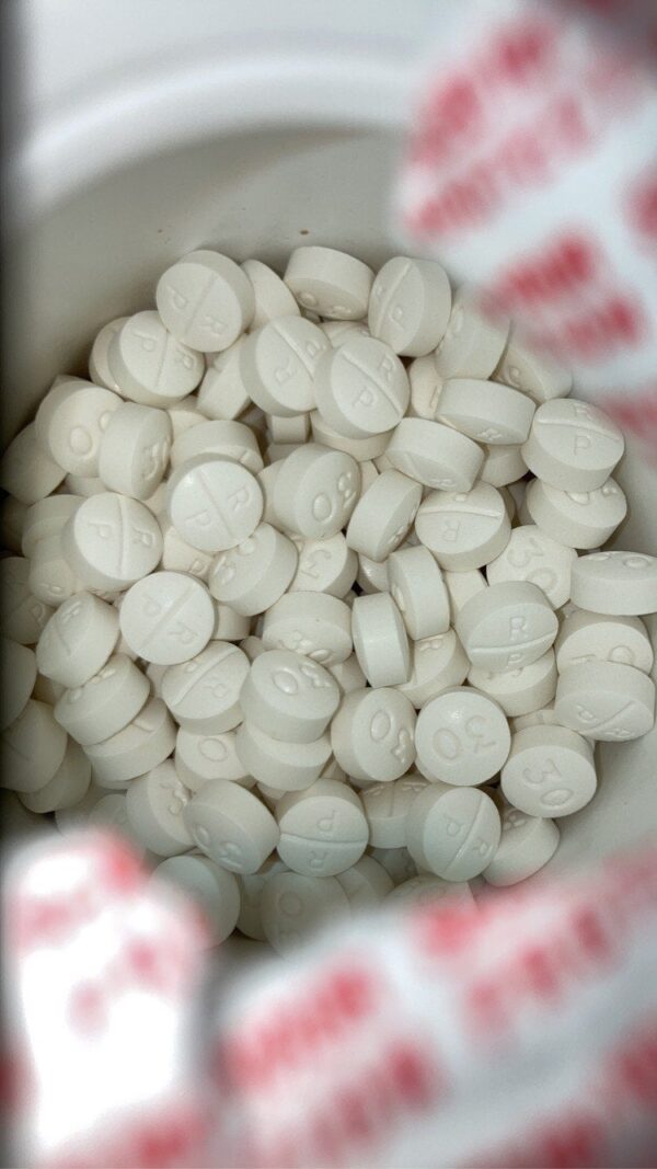 Oxycodone Hydrochloride Oxycodone, sold under various brand names such as Roxicodone and OxyContin (which is the extended release form), is a semi-synthetic opioid used medically for treatment of moderate to severe pain. It is highly addictive and It is usually taken by mouth, and is available in immediate-release and controlled-release formulations. Onset of pain relief typically begins within fifteen minutes and lasts for up to six hours with the immediate-release formulation. In the United Kingdom, it is available by injection. Combination products are also available with paracetamol (acetaminophen), ibuprofen, naloxone, naltrexone, and aspirin. Medical uses Oxycodone is used for managing moderate to severe acute or chronic pain when other treatments are not sufficient. It may improve quality of life in certain types of pain. Numerous studies have been completed, and the appropriate use of this compound does improve the quality of life of patients with long term chronic pain syndromes. Oxycodone is available as a controlled-release tablet, intended to be taken every 12 hours. A 2006 review found that controlled-release oxycodone is comparable to immediate-release oxycodone, morphine, and hydromorphone in management of moderate to severe cancer pain, with fewer side effects than morphine. The author concluded that the controlled-release form is a valid alternative to morphine and a first-line treatment for cancer pain. In 2014, the European Association for Palliative Care recommended oxycodone by mouth as a second-line alternative to morphine by mouth for cancer pain. Available forms See also: Oxycodone/paracetamol, Oxycodone/aspirin, Oxycodone/ibuprofen, and Oxycodone/naloxone Both sides of a single 10mg OxyContin pill. Oxycodone is available in a variety of formulations for by mouth or under the tongue: Immediate-release oxycodone (OxyFast, OxyIR, OxyNorm, Roxicodone) Controlled-release oxycodone (OxyContin, Xtampza ER) – 10–12 hour duration Oxycodone tamper-resistant (OxyContin OTR) Immediate-release oxycodone with paracetamol (acetaminophen) (Percocet, Endocet, Roxicet, Tylox) Immediate-release oxycodone with aspirin (Endodan, Oxycodan, Percodan, Roxiprin) Immediate-release oxycodone with ibuprofen (Combunox) Controlled-release oxycodone with naloxone (Targin, Targiniq, Targinact)[38] – 10–12 hour duration Controlled-release oxycodone with naltrexone (Troxyca) – 10–12 hour duration A liquid solution containing 10mg of oxycodone per 1ml In the US, oxycodone is only approved for use by mouth, available as tablets and oral solutions. Parenteral formulations of oxycodone (brand name OxyNorm) are also available in other parts of the world, however, and are widely used in the European Union. In Spain, the Netherlands and the United Kingdom, oxycodone is approved for intravenous (IV) and intramuscular (IM) use. When first introduced in Germany during World War I, both IV and IM administrations of oxycodone were commonly used for postoperative pain management of Central Powers soldiers. Oxycodone, like other opioid analgesics, tends to induce feelings of euphoria, relaxation and reduced anxiety in those who are occasional users. These effects make it one of the most commonly abused pharmaceutical drugs in the United States. The abuse of Oxycodone, as well as related opioids more broadly, is not unique to the United States and is a common drug of abuse globally. Uses for Oxycodone Acute Pain Relief of moderate to severe pain when use of an opiate analgesic is appropriate and alternative treatments are inadequate. Usually, temporary relief of moderate to moderately severe pain such as that associated with acute and some chronic medical disorders including renal or biliary colic, acute trauma, postoperative pain, and cancer. Opiates given orally in combination with acetaminophen or NSAIAs may produce greater analgesic effect than either drug alone; may also cause fewer adverse effects than equianalgesic doses of the individual drugs alone. Extended-release oxycodone hydrochloride/acetaminophen in fixed combination: Relief of acute pain that is severe enough to require opiate therapy and for which alternative treatments (e.g., nonopiate analgesics) are inadequate or not tolerated. In symptomatic treatment of acute pain, reserve opiate analgesics for pain resulting from severe injuries, severe medical conditions, or surgical procedures, or when nonopiate alternatives for relieving pain and restoring function are expected to be ineffective or are contraindicated. Use smallest effective dosage for shortest possible duration since long-term opiate use often begins with treatment of acute pain. Optimize concomitant use of other appropriate therapies. (See Managing Opiate Therapy for Acute Pain under Dosage and Administration.) Reserve oxycodone hydrochloride extended-release tablets and oxycodone myristate extended-release capsules for relief of pain that is severe enough to require long-term, daily, around-the-clock use of an opiate analgesic and for which alternative treatment options (e.g., nonopiate analgesics or immediate-release opiates) are inadequate or not tolerated; not indicated for as-needed (“prn”) use. Chronic Pain For relief of moderate to severe malignant (cancer) pain and chronic nonmalignant pain when use of an opiate analgesic is appropriate and alternative treatments are inadequate. Oxycodone hydrochloride extended-release tablets and oxycodone myristate extended-release capsules: Use only for relief of pain that is severe enough to require long-term, daily, around-the-clock use of an opiate analgesic and for which alternative treatment options (e.g., nonopiate analgesics, immediate-release opiates) are inadequate or not tolerated. Not indicated for as-needed (“prn”) use. In the management of chronic pain associated with a terminal illness such as cancer, the principal goal of analgesic therapy is to make the patient relatively pain-free while maintaining as good a quality of life as possible. Oxycodone Hydrochloride Extended-release Tablets Swallow tablets whole; do not break, cut, dissolve, crush, or chew. (See Respiratory Depression in Boxed Warning.) Oxycodone Generic name: oxycodone [ ox-i-KOE-done ] Brand names: Oxaydo, OxyContin, Oxyfast, Roxicodone, RoxyBond, Xtampza ER; oxycodone is also present in the following combination drugs: Combunox, Endocet, Endodan, Moxduo, Oxycodan, Percocet, Percodan, Primlev, Roxicet, Xartemis XR, and others Oxycodone -Brand names: Oxycontin, Oxypro, Longtec, Reltebon, Zomestine