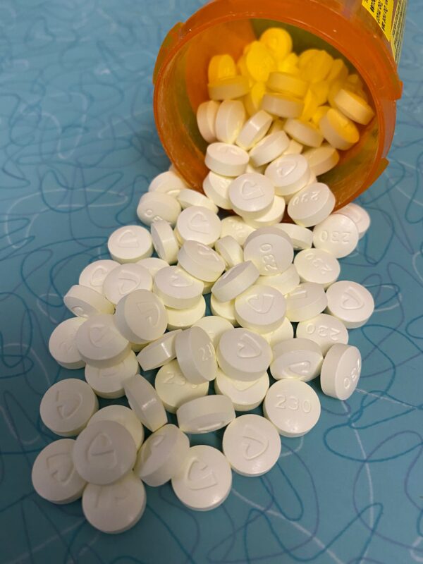 Oxycodone Hydrochloride Oxycodone, sold under various brand names such as Roxicodone and OxyContin (which is the extended release form), is a semi-synthetic opioid used medically for treatment of moderate to severe pain. It is highly addictive and It is usually taken by mouth, and is available in immediate-release and controlled-release formulations. Onset of pain relief typically begins within fifteen minutes and lasts for up to six hours with the immediate-release formulation. In the United Kingdom, it is available by injection. Combination products are also available with paracetamol (acetaminophen), ibuprofen, naloxone, naltrexone, and aspirin. Medical uses Oxycodone is used for managing moderate to severe acute or chronic pain when other treatments are not sufficient. It may improve quality of life in certain types of pain. Numerous studies have been completed, and the appropriate use of this compound does improve the quality of life of patients with long term chronic pain syndromes. Oxycodone is available as a controlled-release tablet, intended to be taken every 12 hours. A 2006 review found that controlled-release oxycodone is comparable to immediate-release oxycodone, morphine, and hydromorphone in management of moderate to severe cancer pain, with fewer side effects than morphine. The author concluded that the controlled-release form is a valid alternative to morphine and a first-line treatment for cancer pain. In 2014, the European Association for Palliative Care recommended oxycodone by mouth as a second-line alternative to morphine by mouth for cancer pain. Available forms See also: Oxycodone/paracetamol, Oxycodone/aspirin, Oxycodone/ibuprofen, and Oxycodone/naloxone Both sides of a single 10mg OxyContin pill. Oxycodone is available in a variety of formulations for by mouth or under the tongue: Immediate-release oxycodone (OxyFast, OxyIR, OxyNorm, Roxicodone) Controlled-release oxycodone (OxyContin, Xtampza ER) – 10–12 hour duration Oxycodone tamper-resistant (OxyContin OTR) Immediate-release oxycodone with paracetamol (acetaminophen) (Percocet, Endocet, Roxicet, Tylox) Immediate-release oxycodone with aspirin (Endodan, Oxycodan, Percodan, Roxiprin) Immediate-release oxycodone with ibuprofen (Combunox) Controlled-release oxycodone with naloxone (Targin, Targiniq, Targinact)[38] – 10–12 hour duration Controlled-release oxycodone with naltrexone (Troxyca) – 10–12 hour duration A liquid solution containing 10mg of oxycodone per 1ml In the US, oxycodone is only approved for use by mouth, available as tablets and oral solutions. Parenteral formulations of oxycodone (brand name OxyNorm) are also available in other parts of the world, however, and are widely used in the European Union. In Spain, the Netherlands and the United Kingdom, oxycodone is approved for intravenous (IV) and intramuscular (IM) use. When first introduced in Germany during World War I, both IV and IM administrations of oxycodone were commonly used for postoperative pain management of Central Powers soldiers. Oxycodone, like other opioid analgesics, tends to induce feelings of euphoria, relaxation and reduced anxiety in those who are occasional users. These effects make it one of the most commonly abused pharmaceutical drugs in the United States. The abuse of Oxycodone, as well as related opioids more broadly, is not unique to the United States and is a common drug of abuse globally. Uses for Oxycodone Acute Pain Relief of moderate to severe pain when use of an opiate analgesic is appropriate and alternative treatments are inadequate. Usually, temporary relief of moderate to moderately severe pain such as that associated with acute and some chronic medical disorders including renal or biliary colic, acute trauma, postoperative pain, and cancer. Opiates given orally in combination with acetaminophen or NSAIAs may produce greater analgesic effect than either drug alone; may also cause fewer adverse effects than equianalgesic doses of the individual drugs alone. Extended-release oxycodone hydrochloride/acetaminophen in fixed combination: Relief of acute pain that is severe enough to require opiate therapy and for which alternative treatments (e.g., nonopiate analgesics) are inadequate or not tolerated. In symptomatic treatment of acute pain, reserve opiate analgesics for pain resulting from severe injuries, severe medical conditions, or surgical procedures, or when nonopiate alternatives for relieving pain and restoring function are expected to be ineffective or are contraindicated. Use smallest effective dosage for shortest possible duration since long-term opiate use often begins with treatment of acute pain. Optimize concomitant use of other appropriate therapies. (See Managing Opiate Therapy for Acute Pain under Dosage and Administration.) Reserve oxycodone hydrochloride extended-release tablets and oxycodone myristate extended-release capsules for relief of pain that is severe enough to require long-term, daily, around-the-clock use of an opiate analgesic and for which alternative treatment options (e.g., nonopiate analgesics or immediate-release opiates) are inadequate or not tolerated; not indicated for as-needed (“prn”) use. Chronic Pain For relief of moderate to severe malignant (cancer) pain and chronic nonmalignant pain when use of an opiate analgesic is appropriate and alternative treatments are inadequate. Oxycodone hydrochloride extended-release tablets and oxycodone myristate extended-release capsules: Use only for relief of pain that is severe enough to require long-term, daily, around-the-clock use of an opiate analgesic and for which alternative treatment options (e.g., nonopiate analgesics, immediate-release opiates) are inadequate or not tolerated. Not indicated for as-needed (“prn”) use. In the management of chronic pain associated with a terminal illness such as cancer, the principal goal of analgesic therapy is to make the patient relatively pain-free while maintaining as good a quality of life as possible. Oxycodone Hydrochloride Extended-release Tablets Swallow tablets whole; do not break, cut, dissolve, crush, or chew. (See Respiratory Depression in Boxed Warning.) Oxycodone Generic name: oxycodone [ ox-i-KOE-done ] Brand names: Oxaydo, OxyContin, Oxyfast, Roxicodone, RoxyBond, Xtampza ER; oxycodone is also present in the following combination drugs: Combunox, Endocet, Endodan, Moxduo, Oxycodan, Percocet, Percodan, Primlev, Roxicet, Xartemis XR, and others Oxycodone -Brand names: Oxycontin, Oxypro, Longtec, Reltebon, Zomestine