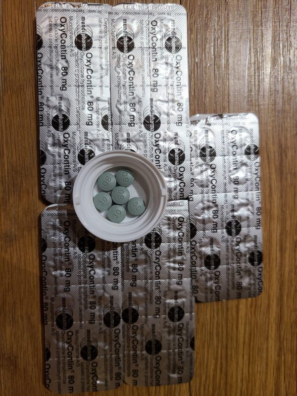 Oxycodone Hydrochloride Oxycodone, sold under various brand names such as Roxicodone and OxyContin (which is the extended release form), is a semi-synthetic opioid used medically for treatment of moderate to severe pain. It is highly addictive and It is usually taken by mouth, and is available in immediate-release and controlled-release formulations. Onset of pain relief typically begins within fifteen minutes and lasts for up to six hours with the immediate-release formulation. In the United Kingdom, it is available by injection. Combination products are also available with paracetamol (acetaminophen), ibuprofen, naloxone, naltrexone, and aspirin. Medical uses Oxycodone is used for managing moderate to severe acute or chronic pain when other treatments are not sufficient. It may improve quality of life in certain types of pain. Numerous studies have been completed, and the appropriate use of this compound does improve the quality of life of patients with long term chronic pain syndromes. Oxycodone is available as a controlled-release tablet, intended to be taken every 12 hours. A 2006 review found that controlled-release oxycodone is comparable to immediate-release oxycodone, morphine, and hydromorphone in management of moderate to severe cancer pain, with fewer side effects than morphine. The author concluded that the controlled-release form is a valid alternative to morphine and a first-line treatment for cancer pain. In 2014, the European Association for Palliative Care recommended oxycodone by mouth as a second-line alternative to morphine by mouth for cancer pain. Available forms See also: Oxycodone/paracetamol, Oxycodone/aspirin, Oxycodone/ibuprofen, and Oxycodone/naloxone Both sides of a single 10mg OxyContin pill. Oxycodone is available in a variety of formulations for by mouth or under the tongue: Immediate-release oxycodone (OxyFast, OxyIR, OxyNorm, Roxicodone) Controlled-release oxycodone (OxyContin, Xtampza ER) – 10–12 hour duration Oxycodone tamper-resistant (OxyContin OTR) Immediate-release oxycodone with paracetamol (acetaminophen) (Percocet, Endocet, Roxicet, Tylox) Immediate-release oxycodone with aspirin (Endodan, Oxycodan, Percodan, Roxiprin) Immediate-release oxycodone with ibuprofen (Combunox) Controlled-release oxycodone with naloxone (Targin, Targiniq, Targinact)[38] – 10–12 hour duration Controlled-release oxycodone with naltrexone (Troxyca) – 10–12 hour duration A liquid solution containing 10mg of oxycodone per 1ml In the US, oxycodone is only approved for use by mouth, available as tablets and oral solutions. Parenteral formulations of oxycodone (brand name OxyNorm) are also available in other parts of the world, however, and are widely used in the European Union. In Spain, the Netherlands and the United Kingdom, oxycodone is approved for intravenous (IV) and intramuscular (IM) use. When first introduced in Germany during World War I, both IV and IM administrations of oxycodone were commonly used for postoperative pain management of Central Powers soldiers. Oxycodone, like other opioid analgesics, tends to induce feelings of euphoria, relaxation and reduced anxiety in those who are occasional users. These effects make it one of the most commonly abused pharmaceutical drugs in the United States. The abuse of Oxycodone, as well as related opioids more broadly, is not unique to the United States and is a common drug of abuse globally. Uses for Oxycodone Acute Pain Relief of moderate to severe pain when use of an opiate analgesic is appropriate and alternative treatments are inadequate. Usually, temporary relief of moderate to moderately severe pain such as that associated with acute and some chronic medical disorders including renal or biliary colic, acute trauma, postoperative pain, and cancer. Opiates given orally in combination with acetaminophen or NSAIAs may produce greater analgesic effect than either drug alone; may also cause fewer adverse effects than equianalgesic doses of the individual drugs alone. Extended-release oxycodone hydrochloride/acetaminophen in fixed combination: Relief of acute pain that is severe enough to require opiate therapy and for which alternative treatments (e.g., nonopiate analgesics) are inadequate or not tolerated. In symptomatic treatment of acute pain, reserve opiate analgesics for pain resulting from severe injuries, severe medical conditions, or surgical procedures, or when nonopiate alternatives for relieving pain and restoring function are expected to be ineffective or are contraindicated. Use smallest effective dosage for shortest possible duration since long-term opiate use often begins with treatment of acute pain. Optimize concomitant use of other appropriate therapies. (See Managing Opiate Therapy for Acute Pain under Dosage and Administration.) Reserve oxycodone hydrochloride extended-release tablets and oxycodone myristate extended-release capsules for relief of pain that is severe enough to require long-term, daily, around-the-clock use of an opiate analgesic and for which alternative treatment options (e.g., nonopiate analgesics or immediate-release opiates) are inadequate or not tolerated; not indicated for as-needed (“prn”) use. Chronic Pain For relief of moderate to severe malignant (cancer) pain and chronic nonmalignant pain when use of an opiate analgesic is appropriate and alternative treatments are inadequate. Oxycodone hydrochloride extended-release tablets and oxycodone myristate extended-release capsules: Use only for relief of pain that is severe enough to require long-term, daily, around-the-clock use of an opiate analgesic and for which alternative treatment options (e.g., nonopiate analgesics, immediate-release opiates) are inadequate or not tolerated. Not indicated for as-needed (“prn”) use. In the management of chronic pain associated with a terminal illness such as cancer, the principal goal of analgesic therapy is to make the patient relatively pain-free while maintaining as good a quality of life as possible. Oxycodone Hydrochloride Extended-release Tablets Swallow tablets whole; do not break, cut, dissolve, crush, or chew. (See Respiratory Depression in Boxed Warning.) Oxycodone Generic name: oxycodone [ ox-i-KOE-done ] Brand names: Oxaydo, OxyContin, Oxyfast, Roxicodone, RoxyBond, Xtampza ER; oxycodone is also present in the following combination drugs: Combunox, Endocet, Endodan, Moxduo, Oxycodan, Percocet, Percodan, Primlev, Roxicet, Xartemis XR, and others Oxycodone -Brand names: Oxycontin, Oxypro, Longtec, Reltebon, Zomestine