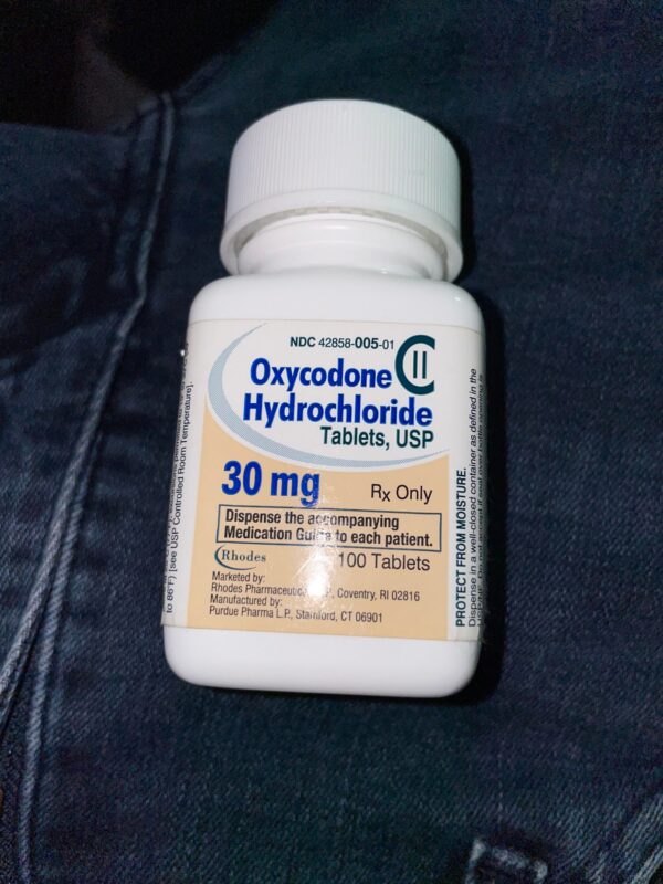 Oxycodone Hydrochloride Oxycodone, sold under various brand names such as Roxicodone and OxyContin (which is the extended release form), is a semi-synthetic opioid used medically for treatment of moderate to severe pain. It is highly addictive and It is usually taken by mouth, and is available in immediate-release and controlled-release formulations. Onset of pain relief typically begins within fifteen minutes and lasts for up to six hours with the immediate-release formulation. In the United Kingdom, it is available by injection. Combination products are also available with paracetamol (acetaminophen), ibuprofen, naloxone, naltrexone, and aspirin. Medical uses Oxycodone is used for managing moderate to severe acute or chronic pain when other treatments are not sufficient. It may improve quality of life in certain types of pain. Numerous studies have been completed, and the appropriate use of this compound does improve the quality of life of patients with long term chronic pain syndromes. Oxycodone is available as a controlled-release tablet, intended to be taken every 12 hours. A 2006 review found that controlled-release oxycodone is comparable to immediate-release oxycodone, morphine, and hydromorphone in management of moderate to severe cancer pain, with fewer side effects than morphine. The author concluded that the controlled-release form is a valid alternative to morphine and a first-line treatment for cancer pain. In 2014, the European Association for Palliative Care recommended oxycodone by mouth as a second-line alternative to morphine by mouth for cancer pain. Available forms See also: Oxycodone/paracetamol, Oxycodone/aspirin, Oxycodone/ibuprofen, and Oxycodone/naloxone Both sides of a single 10mg OxyContin pill. Oxycodone is available in a variety of formulations for by mouth or under the tongue: Immediate-release oxycodone (OxyFast, OxyIR, OxyNorm, Roxicodone) Controlled-release oxycodone (OxyContin, Xtampza ER) – 10–12 hour duration Oxycodone tamper-resistant (OxyContin OTR) Immediate-release oxycodone with paracetamol (acetaminophen) (Percocet, Endocet, Roxicet, Tylox) Immediate-release oxycodone with aspirin (Endodan, Oxycodan, Percodan, Roxiprin) Immediate-release oxycodone with ibuprofen (Combunox) Controlled-release oxycodone with naloxone (Targin, Targiniq, Targinact)[38] – 10–12 hour duration Controlled-release oxycodone with naltrexone (Troxyca) – 10–12 hour duration A liquid solution containing 10mg of oxycodone per 1ml In the US, oxycodone is only approved for use by mouth, available as tablets and oral solutions. Parenteral formulations of oxycodone (brand name OxyNorm) are also available in other parts of the world, however, and are widely used in the European Union. In Spain, the Netherlands and the United Kingdom, oxycodone is approved for intravenous (IV) and intramuscular (IM) use. When first introduced in Germany during World War I, both IV and IM administrations of oxycodone were commonly used for postoperative pain management of Central Powers soldiers. Oxycodone, like other opioid analgesics, tends to induce feelings of euphoria, relaxation and reduced anxiety in those who are occasional users. These effects make it one of the most commonly abused pharmaceutical drugs in the United States. The abuse of Oxycodone, as well as related opioids more broadly, is not unique to the United States and is a common drug of abuse globally. Uses for Oxycodone Acute Pain Relief of moderate to severe pain when use of an opiate analgesic is appropriate and alternative treatments are inadequate. Usually, temporary relief of moderate to moderately severe pain such as that associated with acute and some chronic medical disorders including renal or biliary colic, acute trauma, postoperative pain, and cancer. Opiates given orally in combination with acetaminophen or NSAIAs may produce greater analgesic effect than either drug alone; may also cause fewer adverse effects than equianalgesic doses of the individual drugs alone. Extended-release oxycodone hydrochloride/acetaminophen in fixed combination: Relief of acute pain that is severe enough to require opiate therapy and for which alternative treatments (e.g., nonopiate analgesics) are inadequate or not tolerated. In symptomatic treatment of acute pain, reserve opiate analgesics for pain resulting from severe injuries, severe medical conditions, or surgical procedures, or when nonopiate alternatives for relieving pain and restoring function are expected to be ineffective or are contraindicated. Use smallest effective dosage for shortest possible duration since long-term opiate use often begins with treatment of acute pain. Optimize concomitant use of other appropriate therapies. (See Managing Opiate Therapy for Acute Pain under Dosage and Administration.) Reserve oxycodone hydrochloride extended-release tablets and oxycodone myristate extended-release capsules for relief of pain that is severe enough to require long-term, daily, around-the-clock use of an opiate analgesic and for which alternative treatment options (e.g., nonopiate analgesics or immediate-release opiates) are inadequate or not tolerated; not indicated for as-needed (“prn”) use. Chronic Pain For relief of moderate to severe malignant (cancer) pain and chronic nonmalignant pain when use of an opiate analgesic is appropriate and alternative treatments are inadequate. Oxycodone hydrochloride extended-release tablets and oxycodone myristate extended-release capsules: Use only for relief of pain that is severe enough to require long-term, daily, around-the-clock use of an opiate analgesic and for which alternative treatment options (e.g., nonopiate analgesics, immediate-release opiates) are inadequate or not tolerated. Not indicated for as-needed (“prn”) use. In the management of chronic pain associated with a terminal illness such as cancer, the principal goal of analgesic therapy is to make the patient relatively pain-free while maintaining as good a quality of life as possible. Oxycodone Hydrochloride Extended-release Tablets Swallow tablets whole; do not break, cut, dissolve, crush, or chew. (See Respiratory Depression in Boxed Warning.) Oxycodone Generic name: oxycodone [ ox-i-KOE-done ] Brand names: Oxaydo, OxyContin, Oxyfast, Roxicodone, RoxyBond, Xtampza ER; oxycodone is also present in the following combination drugs: Combunox, Endocet, Endodan, Moxduo, Oxycodan, Percocet, Percodan, Primlev, Roxicet, Xartemis XR, and others Oxycodone -Brand names: Oxycontin, Oxypro, Longtec, Reltebon, Zomestine