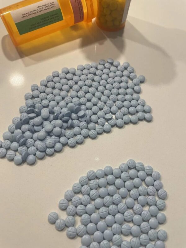 Oxycodone Hydrochloride Oxycodone, sold under various brand names such as Roxicodone and OxyContin (which is the extended release form), is a semi-synthetic opioid used medically for treatment of moderate to severe pain. It is highly addictive and It is usually taken by mouth, and is available in immediate-release and controlled-release formulations. Onset of pain relief typically begins within fifteen minutes and lasts for up to six hours with the immediate-release formulation. In the United Kingdom, it is available by injection. Combination products are also available with paracetamol (acetaminophen), ibuprofen, naloxone, naltrexone, and aspirin. Medical uses Oxycodone is used for managing moderate to severe acute or chronic pain when other treatments are not sufficient. It may improve quality of life in certain types of pain. Numerous studies have been completed, and the appropriate use of this compound does improve the quality of life of patients with long term chronic pain syndromes. Oxycodone is available as a controlled-release tablet, intended to be taken every 12 hours. A 2006 review found that controlled-release oxycodone is comparable to immediate-release oxycodone, morphine, and hydromorphone in management of moderate to severe cancer pain, with fewer side effects than morphine. The author concluded that the controlled-release form is a valid alternative to morphine and a first-line treatment for cancer pain. In 2014, the European Association for Palliative Care recommended oxycodone by mouth as a second-line alternative to morphine by mouth for cancer pain. Available forms See also: Oxycodone/paracetamol, Oxycodone/aspirin, Oxycodone/ibuprofen, and Oxycodone/naloxone Both sides of a single 10mg OxyContin pill. Oxycodone is available in a variety of formulations for by mouth or under the tongue: Immediate-release oxycodone (OxyFast, OxyIR, OxyNorm, Roxicodone) Controlled-release oxycodone (OxyContin, Xtampza ER) – 10–12 hour duration Oxycodone tamper-resistant (OxyContin OTR) Immediate-release oxycodone with paracetamol (acetaminophen) (Percocet, Endocet, Roxicet, Tylox) Immediate-release oxycodone with aspirin (Endodan, Oxycodan, Percodan, Roxiprin) Immediate-release oxycodone with ibuprofen (Combunox) Controlled-release oxycodone with naloxone (Targin, Targiniq, Targinact)[38] – 10–12 hour duration Controlled-release oxycodone with naltrexone (Troxyca) – 10–12 hour duration A liquid solution containing 10mg of oxycodone per 1ml In the US, oxycodone is only approved for use by mouth, available as tablets and oral solutions. Parenteral formulations of oxycodone (brand name OxyNorm) are also available in other parts of the world, however, and are widely used in the European Union. In Spain, the Netherlands and the United Kingdom, oxycodone is approved for intravenous (IV) and intramuscular (IM) use. When first introduced in Germany during World War I, both IV and IM administrations of oxycodone were commonly used for postoperative pain management of Central Powers soldiers. Oxycodone, like other opioid analgesics, tends to induce feelings of euphoria, relaxation and reduced anxiety in those who are occasional users. These effects make it one of the most commonly abused pharmaceutical drugs in the United States. The abuse of Oxycodone, as well as related opioids more broadly, is not unique to the United States and is a common drug of abuse globally. Uses for Oxycodone Acute Pain Relief of moderate to severe pain when use of an opiate analgesic is appropriate and alternative treatments are inadequate. Usually, temporary relief of moderate to moderately severe pain such as that associated with acute and some chronic medical disorders including renal or biliary colic, acute trauma, postoperative pain, and cancer. Opiates given orally in combination with acetaminophen or NSAIAs may produce greater analgesic effect than either drug alone; may also cause fewer adverse effects than equianalgesic doses of the individual drugs alone. Extended-release oxycodone hydrochloride/acetaminophen in fixed combination: Relief of acute pain that is severe enough to require opiate therapy and for which alternative treatments (e.g., nonopiate analgesics) are inadequate or not tolerated. In symptomatic treatment of acute pain, reserve opiate analgesics for pain resulting from severe injuries, severe medical conditions, or surgical procedures, or when nonopiate alternatives for relieving pain and restoring function are expected to be ineffective or are contraindicated. Use smallest effective dosage for shortest possible duration since long-term opiate use often begins with treatment of acute pain. Optimize concomitant use of other appropriate therapies. (See Managing Opiate Therapy for Acute Pain under Dosage and Administration.) Reserve oxycodone hydrochloride extended-release tablets and oxycodone myristate extended-release capsules for relief of pain that is severe enough to require long-term, daily, around-the-clock use of an opiate analgesic and for which alternative treatment options (e.g., nonopiate analgesics or immediate-release opiates) are inadequate or not tolerated; not indicated for as-needed (“prn”) use. Chronic Pain For relief of moderate to severe malignant (cancer) pain and chronic nonmalignant pain when use of an opiate analgesic is appropriate and alternative treatments are inadequate. Oxycodone hydrochloride extended-release tablets and oxycodone myristate extended-release capsules: Use only for relief of pain that is severe enough to require long-term, daily, around-the-clock use of an opiate analgesic and for which alternative treatment options (e.g., nonopiate analgesics, immediate-release opiates) are inadequate or not tolerated. Not indicated for as-needed (“prn”) use. In the management of chronic pain associated with a terminal illness such as cancer, the principal goal of analgesic therapy is to make the patient relatively pain-free while maintaining as good a quality of life as possible. Oxycodone Hydrochloride Extended-release Tablets Swallow tablets whole; do not break, cut, dissolve, crush, or chew. (See Respiratory Depression in Boxed Warning.) Oxycodone Generic name: oxycodone [ ox-i-KOE-done ] Brand names: Oxaydo, OxyContin, Oxyfast, Roxicodone, RoxyBond, Xtampza ER; oxycodone is also present in the following combination drugs: Combunox, Endocet, Endodan, Moxduo, Oxycodan, Percocet, Percodan, Primlev, Roxicet, Xartemis XR, and others Oxycodone -Brand names: Oxycontin, Oxypro, Longtec, Reltebon, Zomestine